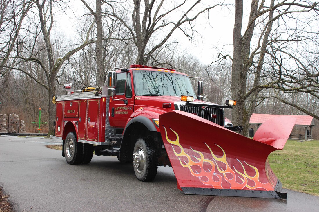 A Reily Fire Truck With a Snow Plow